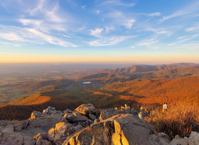 A stunning mountain view during sunset, showcasing amazing landscapes and vast skies in the state.
