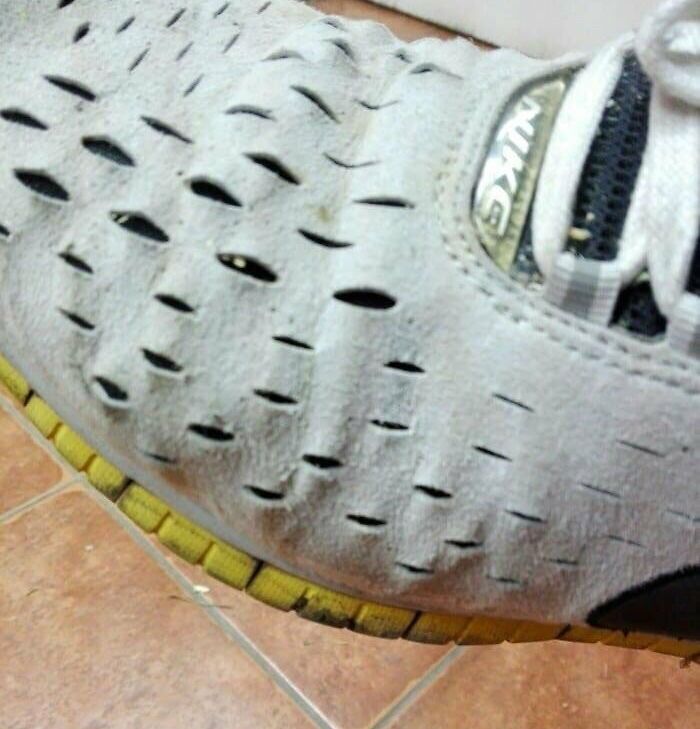 Close-up of a shoe with a pattern resembling a face, showcasing pareidolia in everyday items.