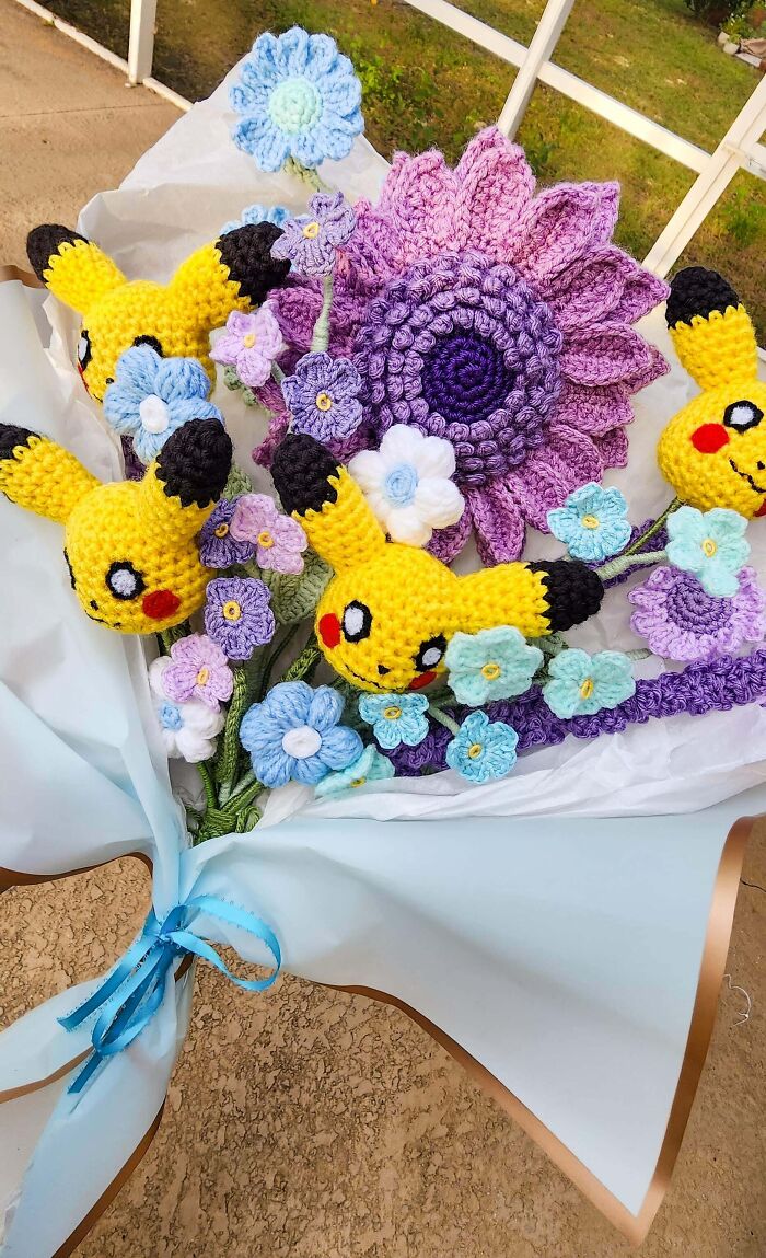 Crochet bouquet with colorful flowers and Pikachu accents for a funny wholesome anniversary surprise.
