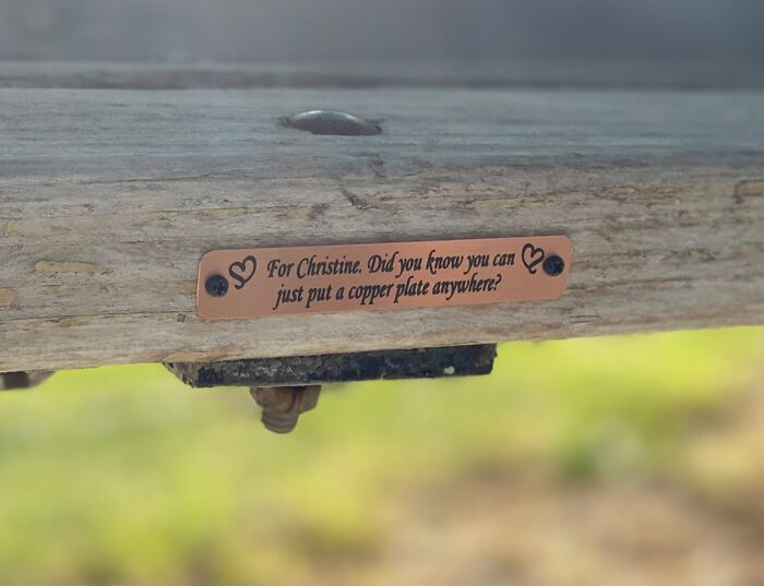 Funny and wholesome anniversary surprise with a humorous copper plate on wooden beam.