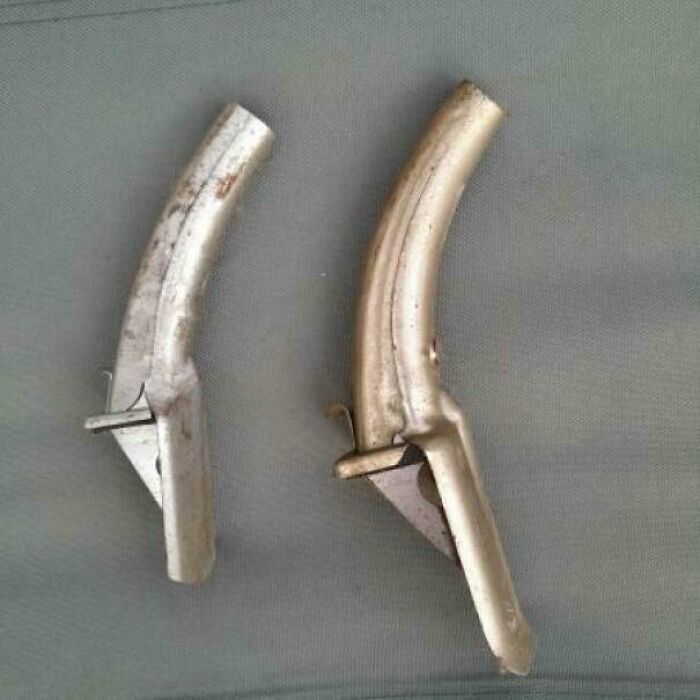 Vintage metal bicycle brake levers showing wear and tear, evoking nostalgic memories from past decades.