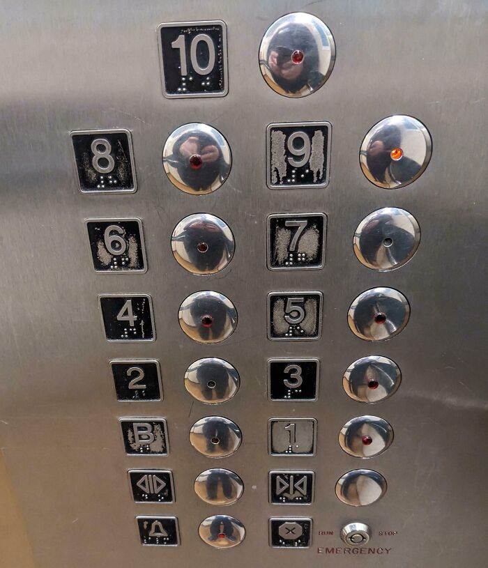 Worn-down elevator buttons showcasing the effects of time and usage.