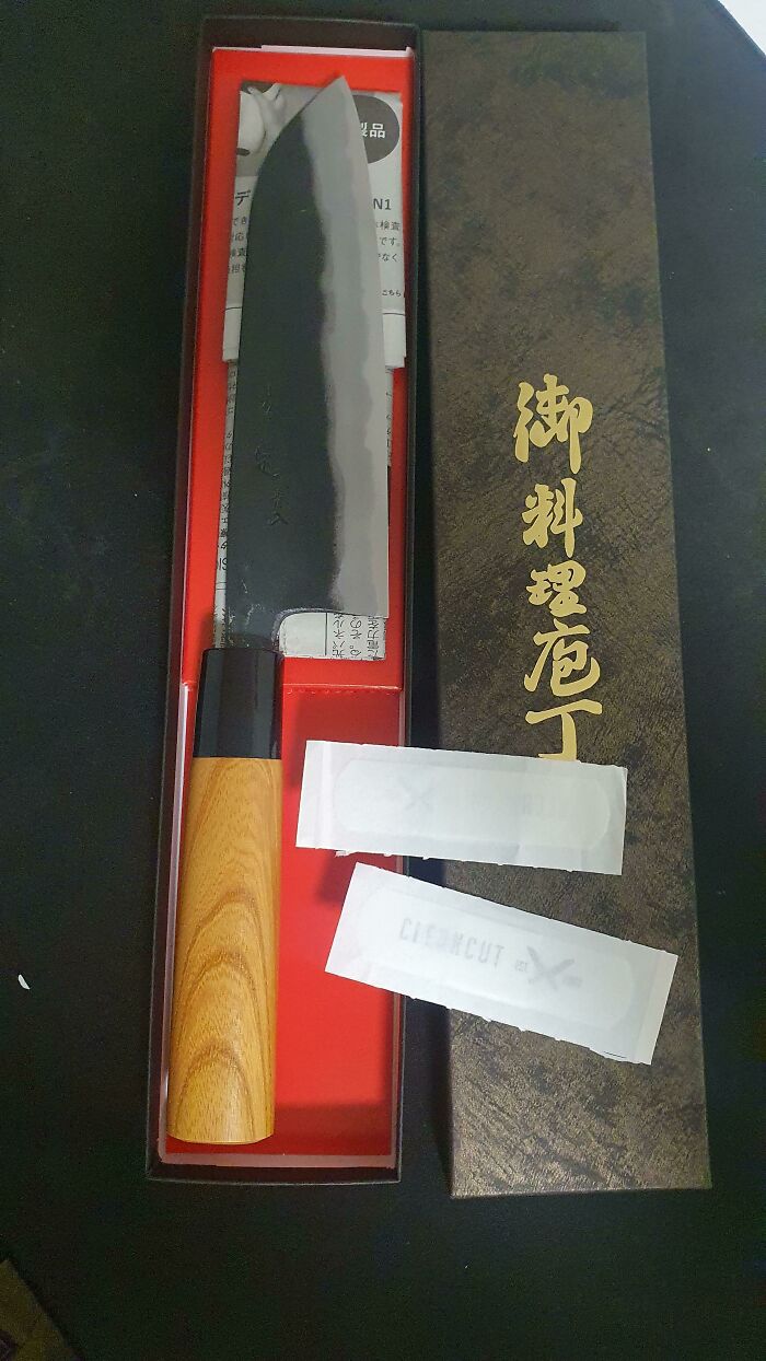 Japanese chef knife in elegant packaging, featuring a sleek blade and wooden handle, showcasing cool product surprises.