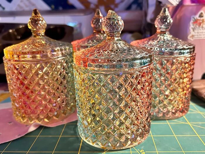 Colorful iridescent glass jars with intricate patterns, showcasing dopamine decor style.