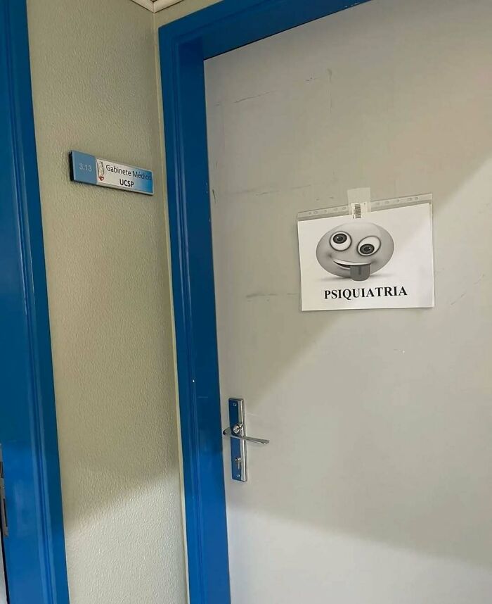 Door with a psychiatry sign showing a goofy emoji, part of random photos you may not know where to begin processing.