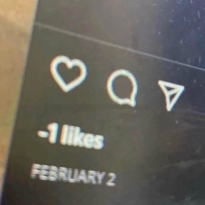 Negative one likes displayed on a social media post showing unusual engagement, part of random photos processing.