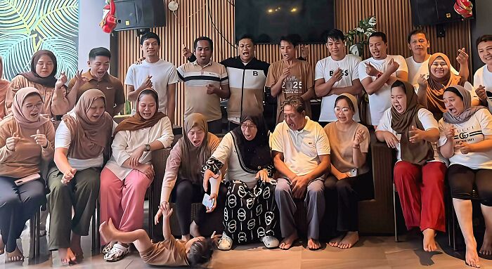 Group of people looking surprised as a child playfully falls, reminiscent of an Accidental Renaissance painting.