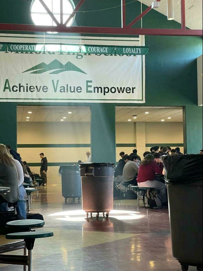 School cafeteria scene with dramatic lighting, capturing an accidental renaissance atmosphere.