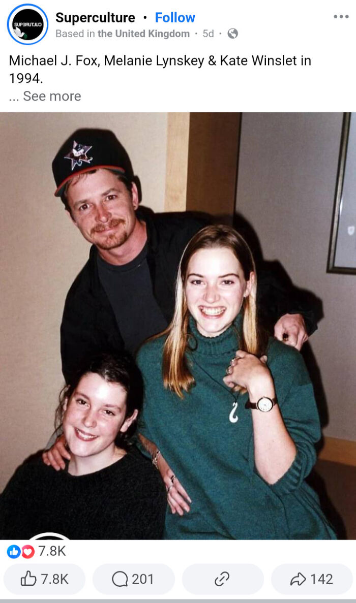 Three people smiling together, capturing a moment from the wild '90s era.