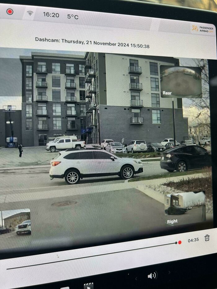 Dashcam footage showing cars parked poorly, illustrating people being complete jerks in a parking lot.