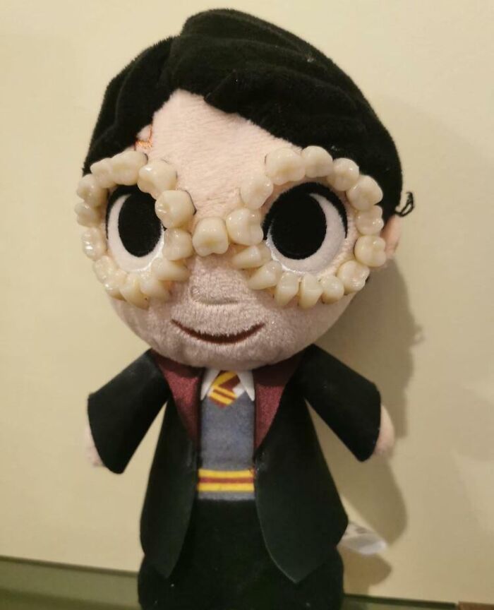 Plush toy with human teeth glasses, creepy things sold online.