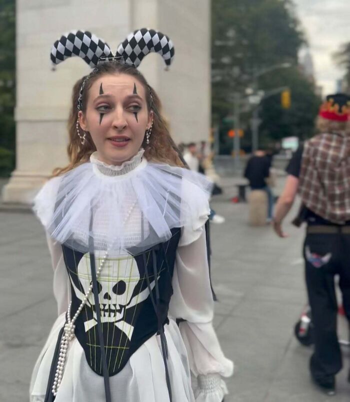 NYC local in a bold fashion outfit with a skull corset and checkered headband, showcasing unique style in New York.