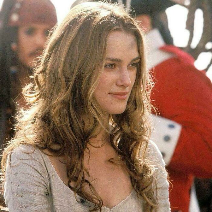 Young woman in period costume with long curly hair in a scene highlighting questionable movie details mocked by cinephiles online.