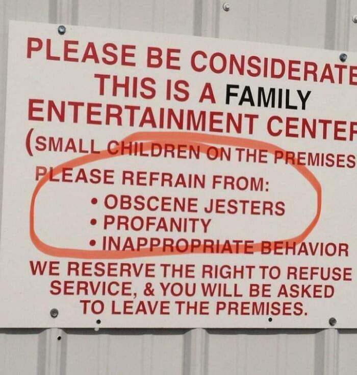 Sign at family center with "obscene jesters" typo, highlighting dumbest posts of 2024.