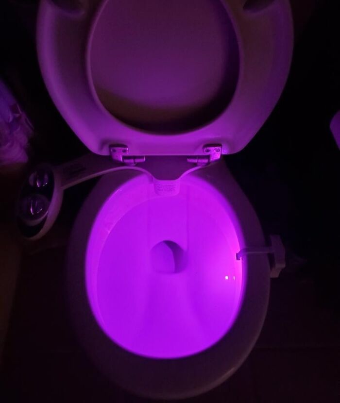 Glowing toilet with purple light, showcasing futuristic tech finds.