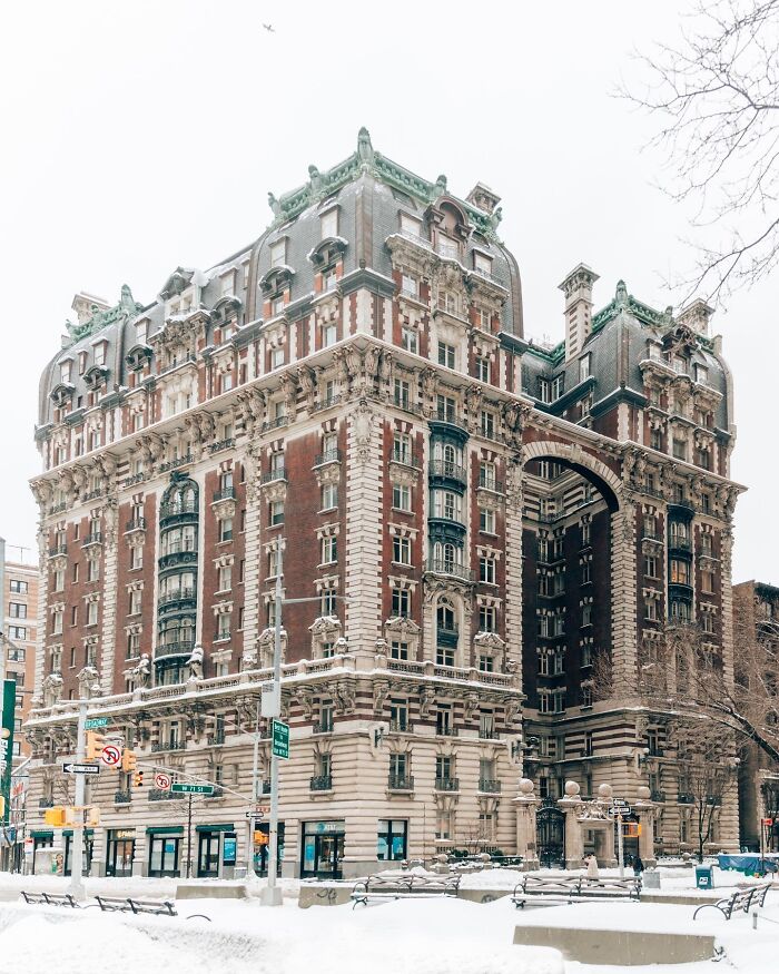 Ornate historic building showcasing impressive architectural feats in a snowy urban setting with intricate detailing.