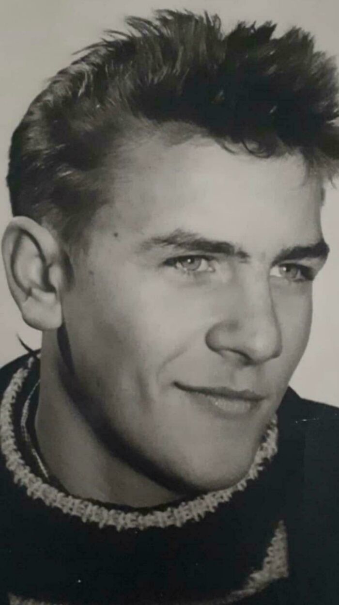 Close-up black and white portrait of a young man in a vintage style, showcasing fascinating old images from history.