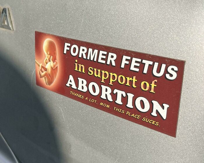 Funny bumper sticker reading "Former Fetus in support of abortion" on a car.