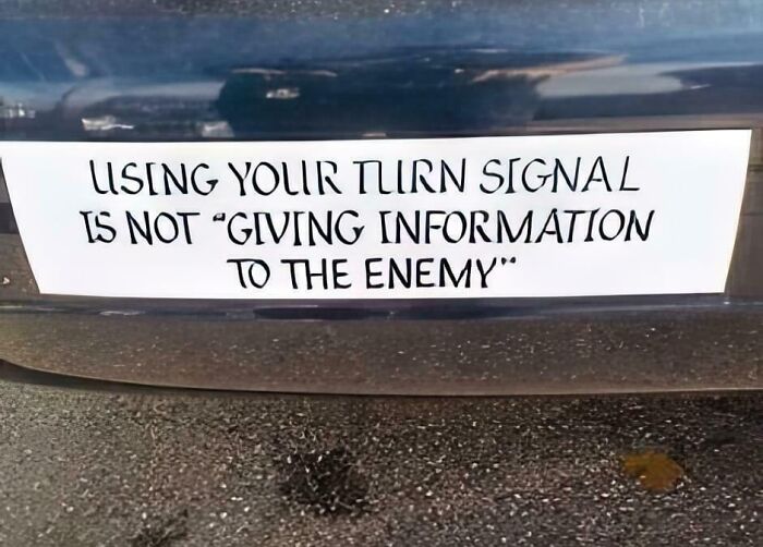 A bumper sticker with humorous text about using turn signals is shown.