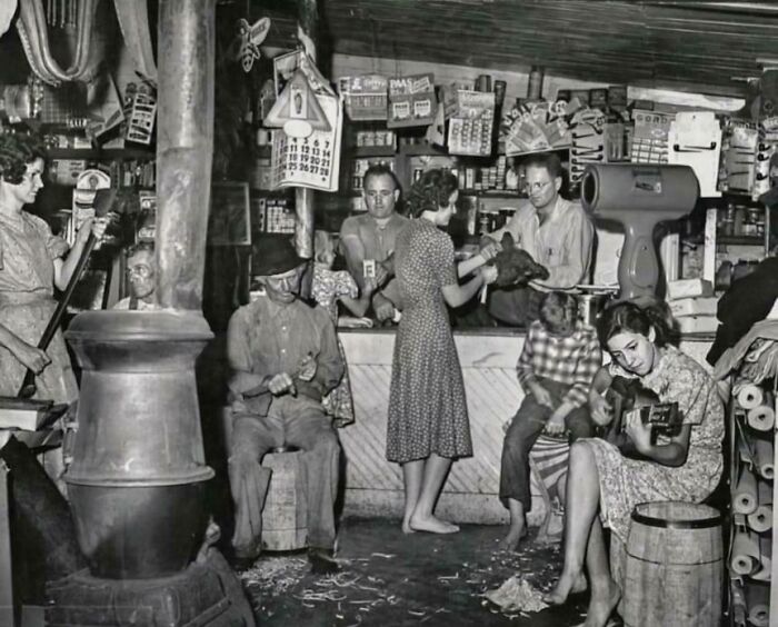 Vintage store scene showing people from decades ago interacting and engaging in a lively, historical setting.