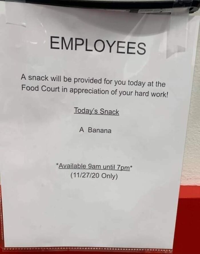 Sign announcing a company gift of a banana as a bonus for employees, available today only at the food court.