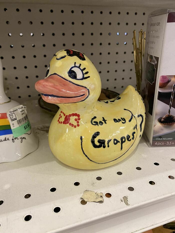 Ceramic duck with "Got any grapes?" text, found as a secondhand treasure on a shelf.