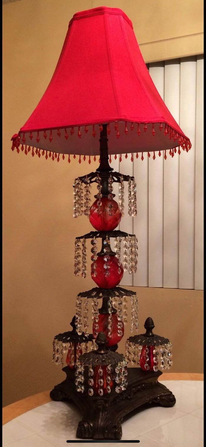 Secondhand find: ornate table lamp with red shade and crystal accents.