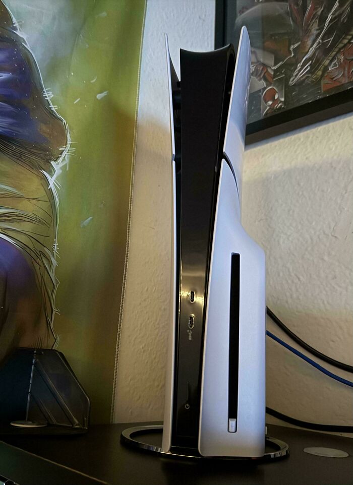 Gaming console resembling a white WiFi router, showcasing an instance of funny online shopping fails.