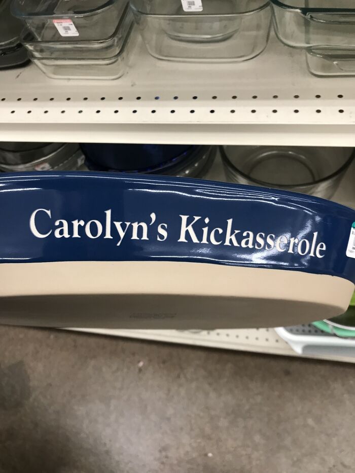 Secondhand find: a baking dish labeled "Carolyn's Kickasserole" on a store shelf.