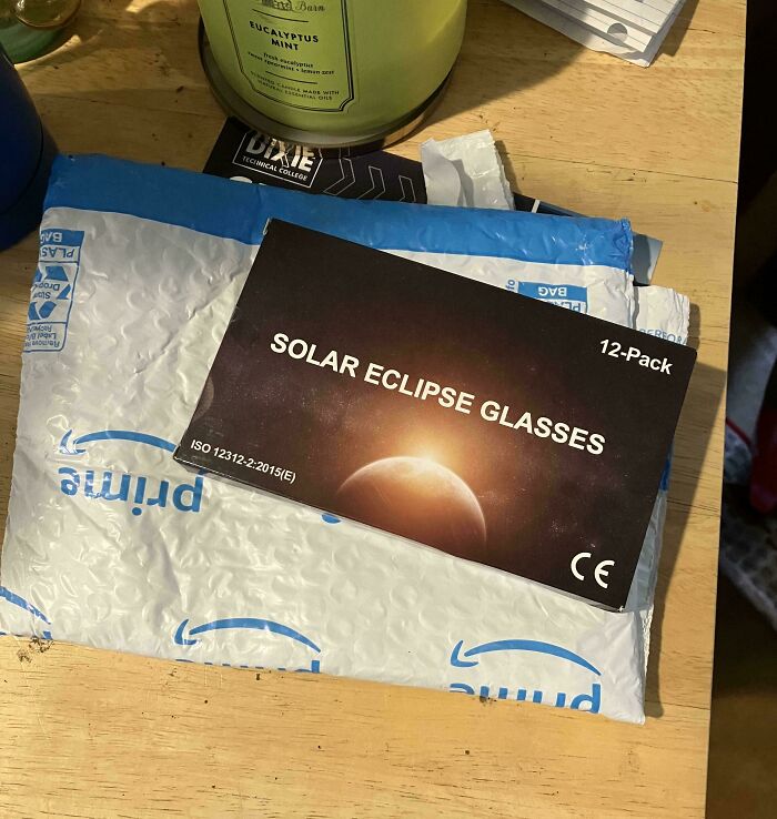 Package labeled "Solar Eclipse Glasses" on a table, showcasing a funny online shopping fail.