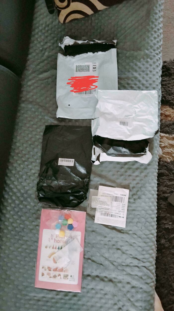 Four online shopping packages on a bed, an example of funny online shopping fails.