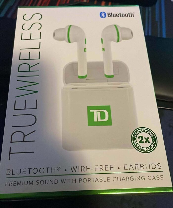 "Company gift earbuds, branded with TD, showcasing Bluetooth wireless feature on packaging."