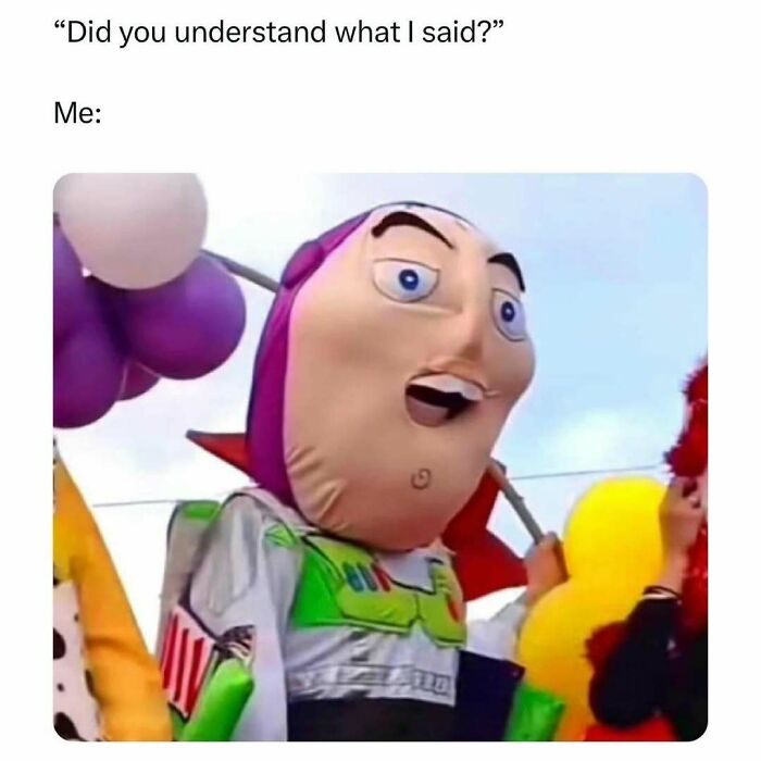 Person wearing a funny oversized Buzz Lightyear costume with a silly expression, capturing humor in barely holding it together.