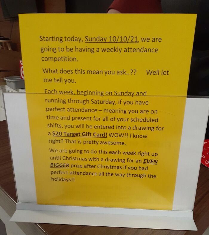 Yellow sign detailing a company gift scheme offering a $20 Target gift card for perfect attendance.