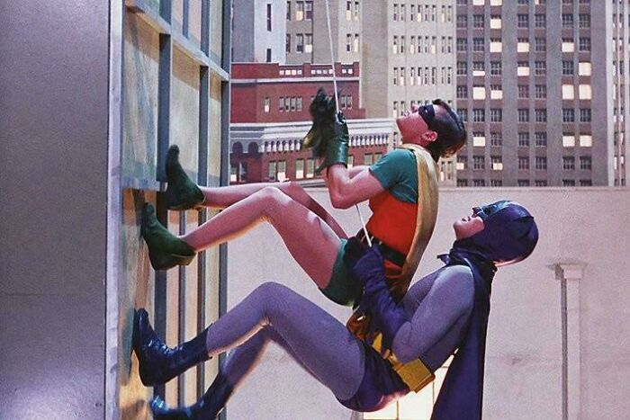 Classic nostalgic photo of Batman and Robin climbing a building, evoking memories that might make you say heck I'm old.