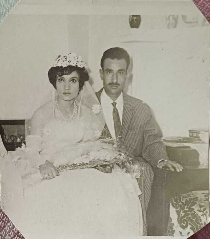 Vintage black and white wedding photo of a bride and groom, showcasing a fascinating old image from history.