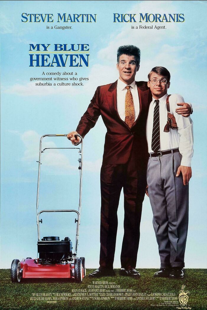 Vintage '90s movie poster featuring two men in suits with a lawnmower.