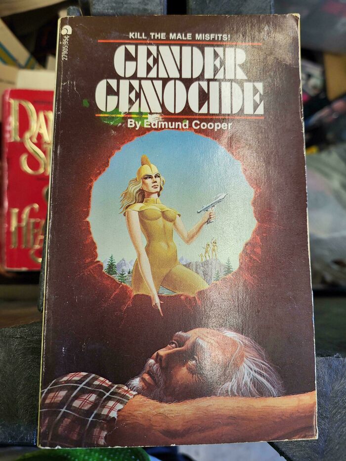 Terrible book cover featuring a woman in yellow with a knife and a man lying below, titled "Gender Genocide."