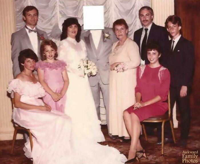 Group portrait of a wedding party capturing an awkward family moment that feels incredibly sweet and memorable.