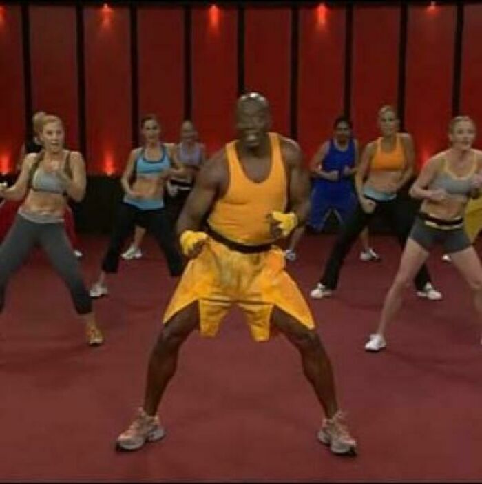 '90s fitness class with instructor in vibrant workout gear, leading a group in an energetic exercise session.