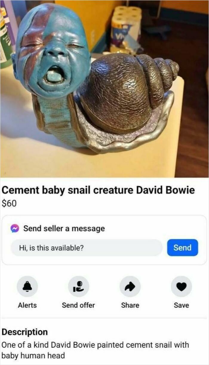 Cement baby snail sculpture with face paint, listed on Facebook Marketplace for $60.