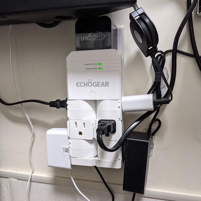 Power strip with multiple outlets and cords plugged in, showcasing affordable 5-star items under $20.
