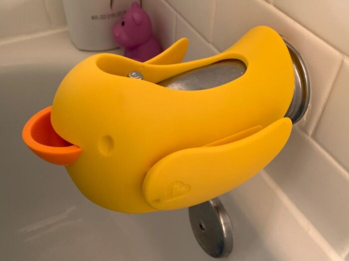 A 5-star rated yellow duck faucet cover suitable for under $20, installed in a bathroom setting.