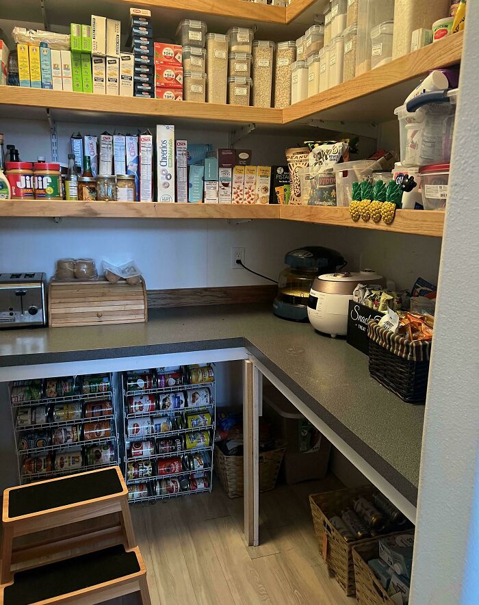 Neat pantry organization with shelves of labeled containers and baskets for optimal storage efficiency.