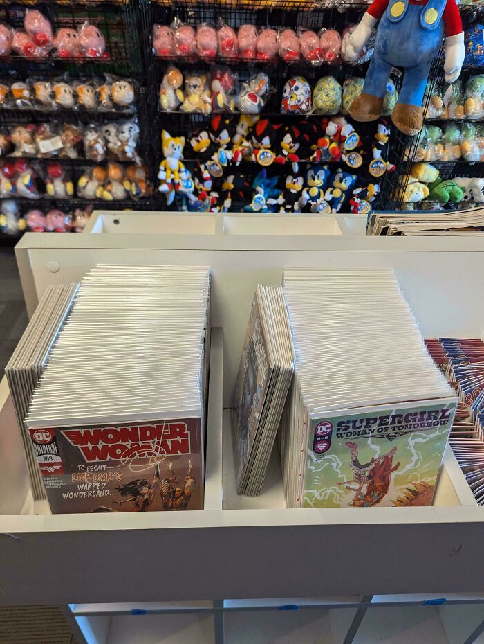 Neatly organized comic books in a store display, showcasing next-level organization.