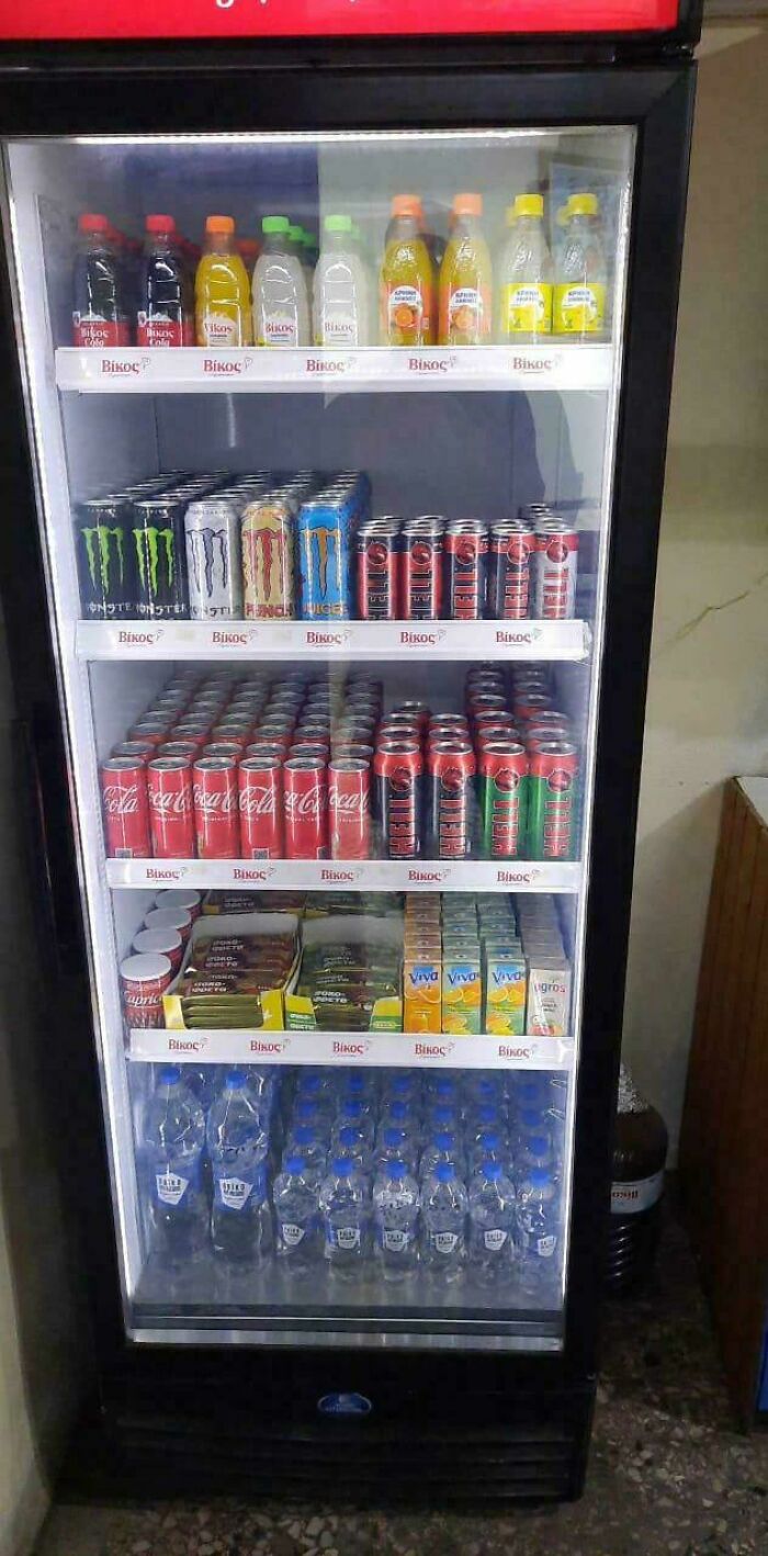 Neat and organized fridge filled with drinks, showcasing next-level organization.