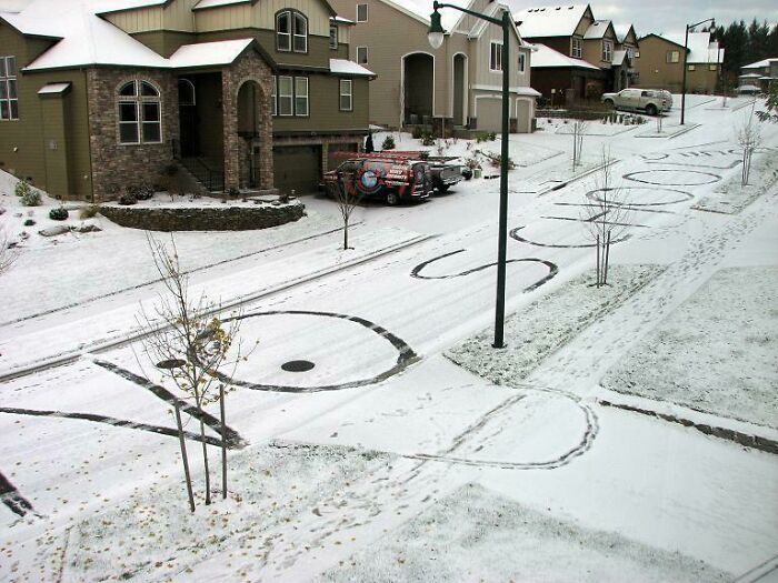 Snowy neighborhood street with the words "Old School."