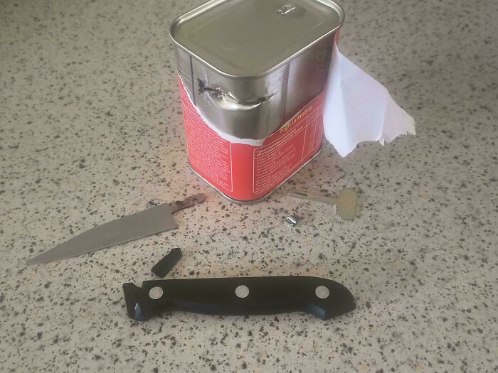Broken knife beside a metal can, illustrating low-quality items people bought.