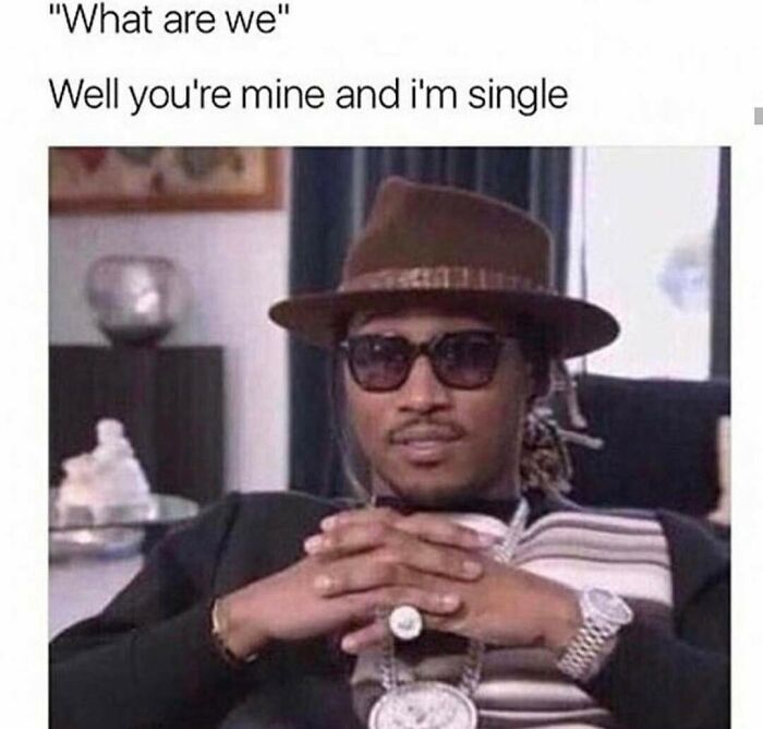 A man wearing a brown hat and sunglasses, with a smirking expression, captures the humor of dating memes.