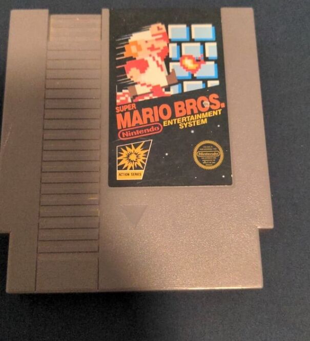 Retro find of a nostalgic Nintendo Super Mario Bros. game cartridge.